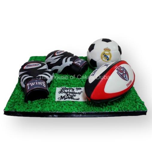 Boxing, rugby and football cake