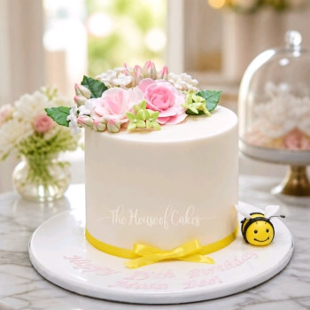 Birthday cake with bee and flowers