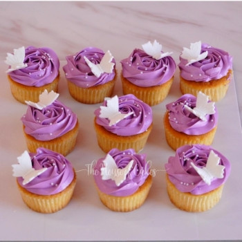 Colourful cupcakes with flowers and butterflies