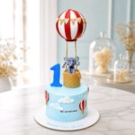 First birthday cake with elephant and balloon