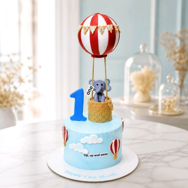 First birthday cake with elephant and balloon