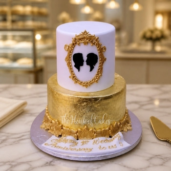 Gold and White Cake with Couple in Frame