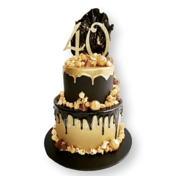 a black and gold cake with a number 40 on top