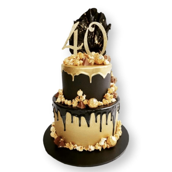 a black and gold cake with a number 40 on top