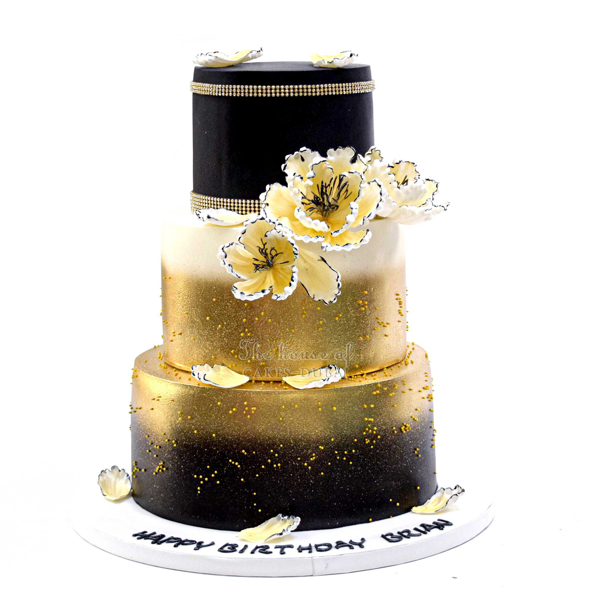 Black cake with gold flowers