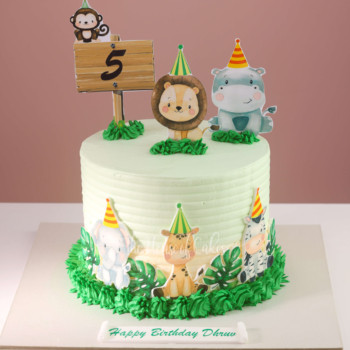 a cake with jungle animals on top