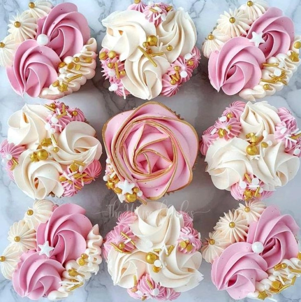 a group of pretty cupcakes with frosting