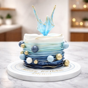Blue ombre cake with sail and balls
