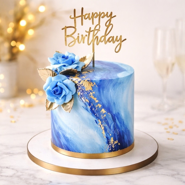Blue Marble and Gold Cake in Dubai – Luxury Custom Desig Experience refined elegance with our Blue Marble and Gold Cake, a true statement of luxury crafted by The House of Cakes Bakery Dubai. This exquisite designer cake features a stunning hand-finished blue marble effect, beautifully contrasted with shimmering gold accents, edible gold leaf, and sophisticated detailing that elevates any celebration. Perfect for birthdays, weddings, corporate events, and high-end celebrations, this cake blends modern artistry with timeless glamour. Each piece is custom-made by our expert cake artists, ensuring every swirl of marble and touch of gold is unique—just like your occasion. We use only the finest premium ingredients, offering a wide range of flavors including rich chocolate, classic vanilla, red velvet, and more. The interior is as indulgent as the exterior is breathtaking. Why choose this cake: Luxury blue marble design with handcrafted gold detailing Fully customizable size, flavors, and message Ideal for elegant celebrations and premium events Made fresh to order in Dubai Available for delivery across all Emirates Make your celebration unforgettable with a cake that speaks sophistication and style. Order your Blue Marble and Gold Cake today from The House of Cakes Bakery – Dubai’s #1 destination for luxury custom cakes.