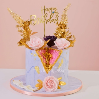 Geode cake with pink crystals and flowers