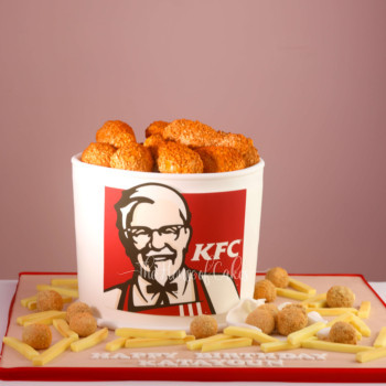 cake in a shape of a KFC bucket of chicken nuggets and french fries
