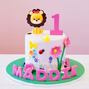 a cake with a lion and number lion girl birthday cake