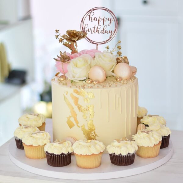 White and gold cake and cupcakes