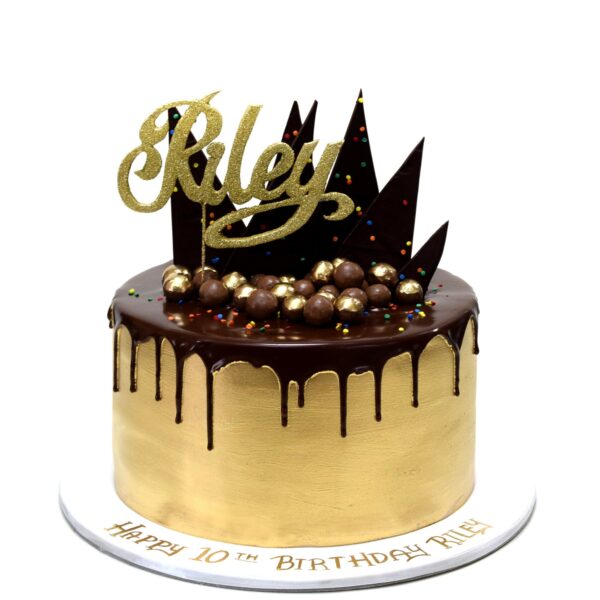 Gold Cake with chocolate drip and cake topper