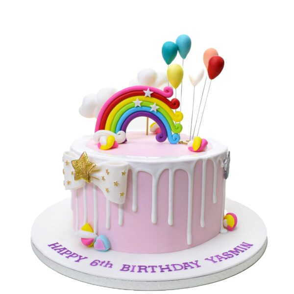 Cake with rainbow and balloons