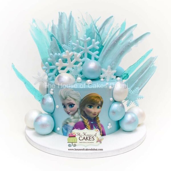 Frozen theme cake with chocolate spheres and brushstrokes