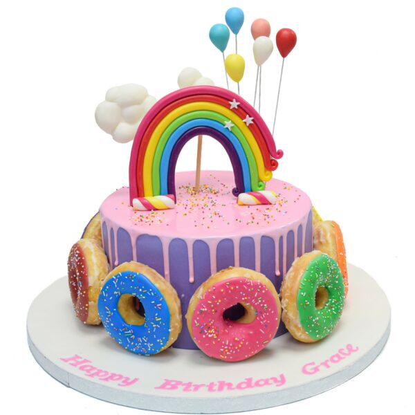 Cake with doughnuts and rainbow