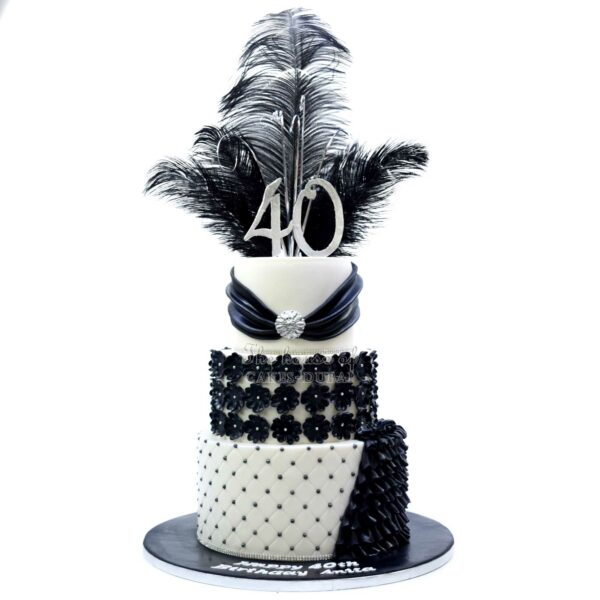 Elegant black and white cake with feathers