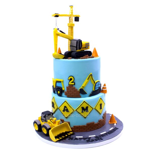 Construction theme cake with cranes and diggers