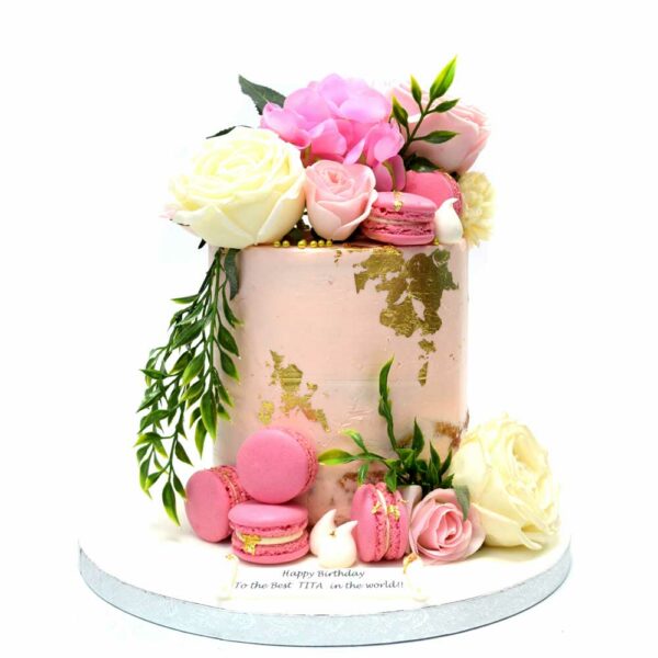 Pink buttercream cake with flowers and gold details