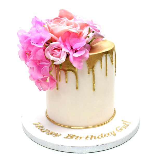 Pretty cake with gold dripping