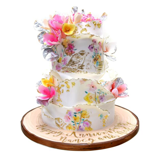 Artistic cake with birds and flowers