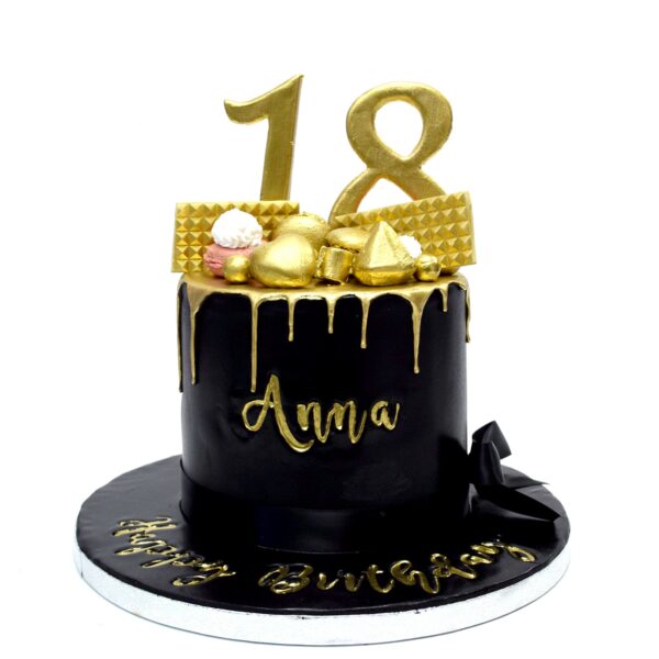 Black cake with gold drip
