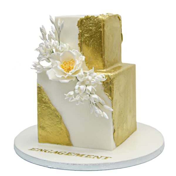 Modern trendy gold and white cake