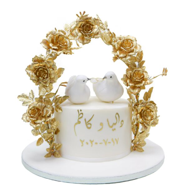 Love birds cake with gold roses arch