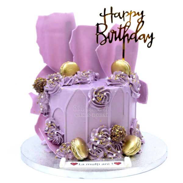 Purple cake with swirls and chocolate decorations