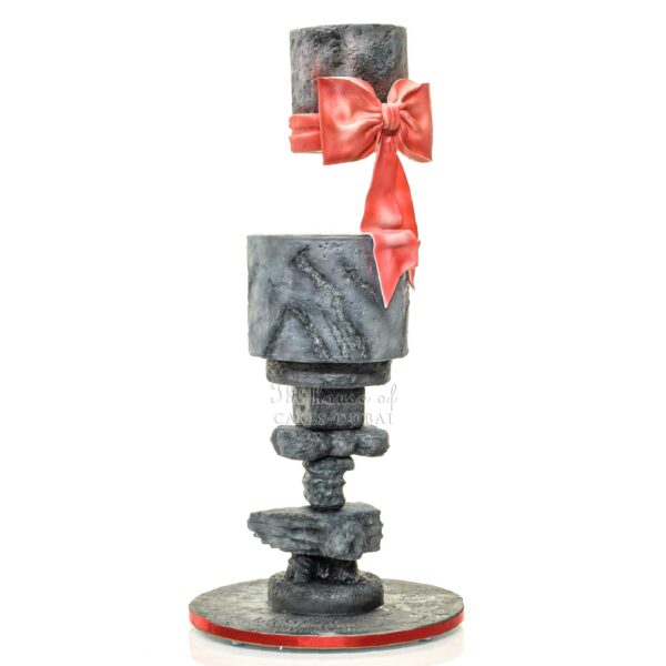 Gravity defying cake grey marble with red bow