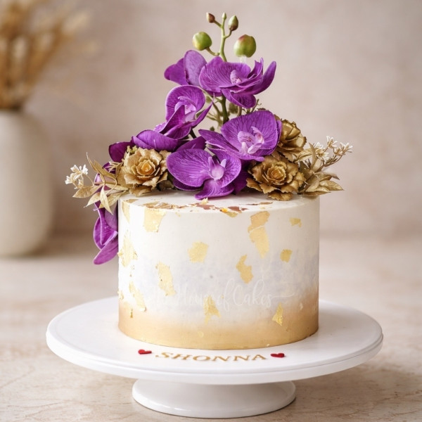 Luxury Cake with Gold Accents and Purple Orchids in Dubai