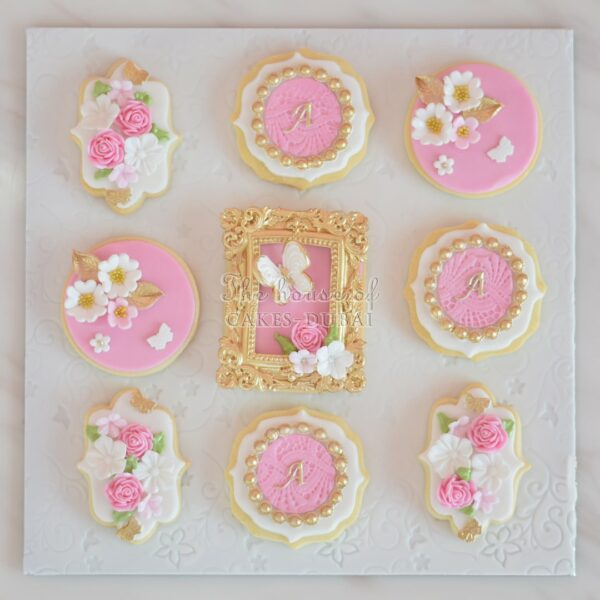 Pretty cookies with flowers frame and letter