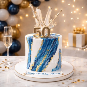 Blue Marble Cake with Sail and Gold Touches