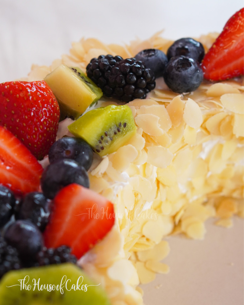 Moon shaped cake with fresh fruits and cream The House of Cakes Dubai