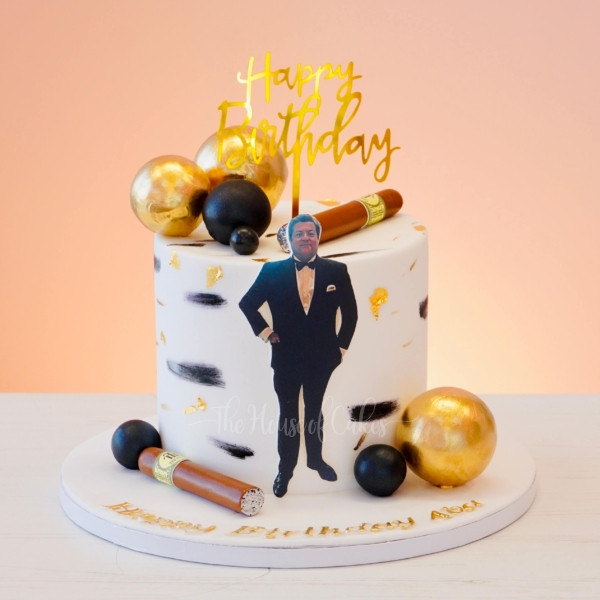 men with tuxedo cake