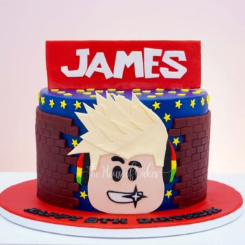 a cake with a roblox cartoon face on it