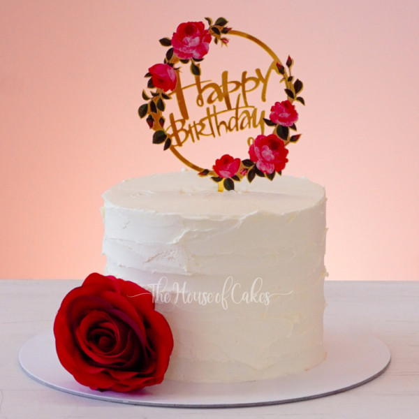 Simple elegant birthday cake with red rose