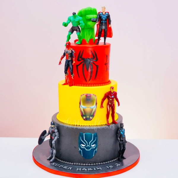a multi-tiered cake with a colorful tiered cake with a colorful background and superheroes figures