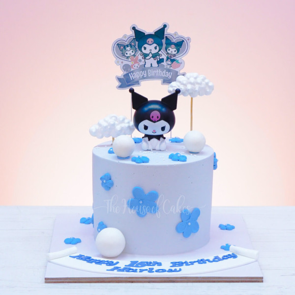a white cake with blue flowers and Kuromi character on top