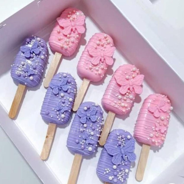 pink and purple cake popsicles
