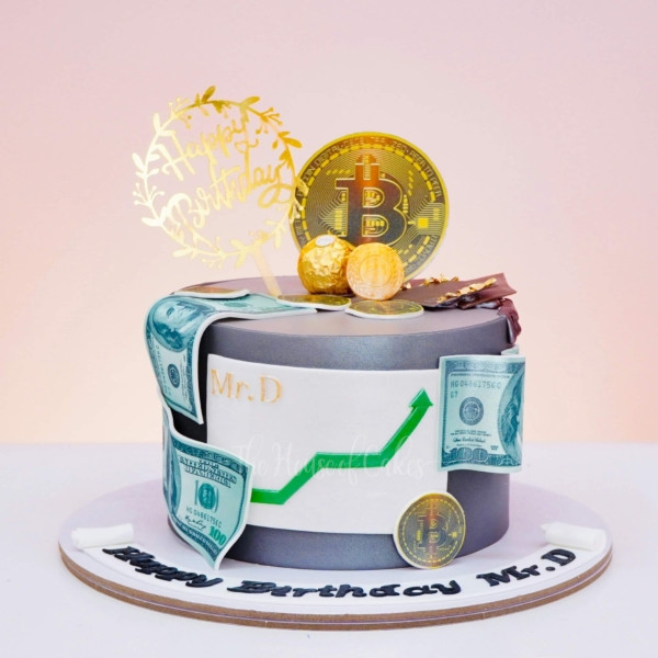 a cake with money and bitcoins on top