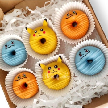 a box of donuts with pokemons