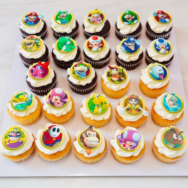 cupcakes with frosting and super mario printed characters