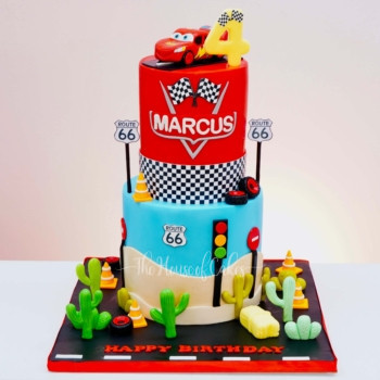 a cake with cars and signs disney cars