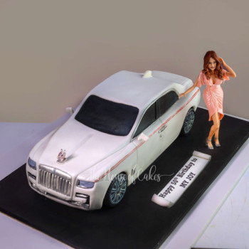 a cake with a model of a car rolls royce