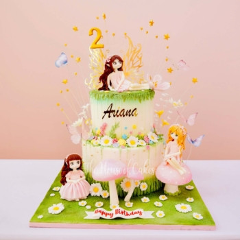 enchanting cake with fairies and flowers