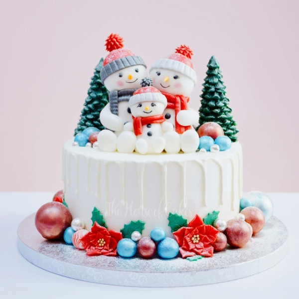 Majestic snowman family cake