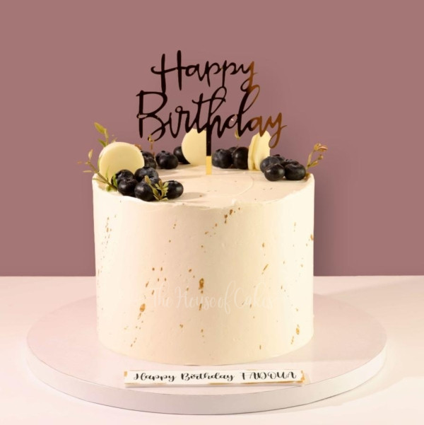 Elegant birthday cake with blueberries