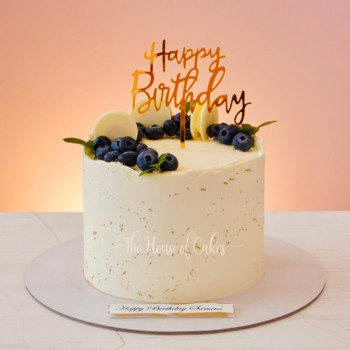 elegant birthday cake with blueberries